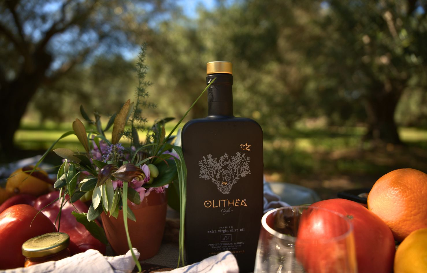A bottle of freshly produced olive oil made from olives gathered during the Olithea harvest experience